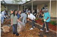 Recycling group raking leaves