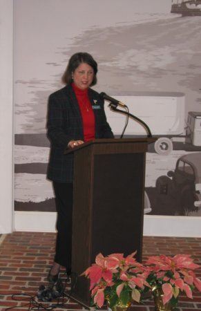 Woman speaking at a podium